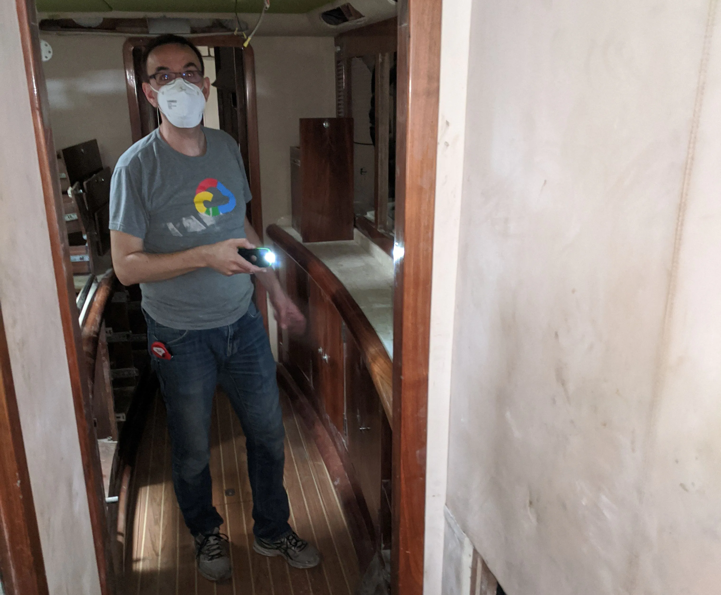 Measuring for new systems Jerome taking measurements.