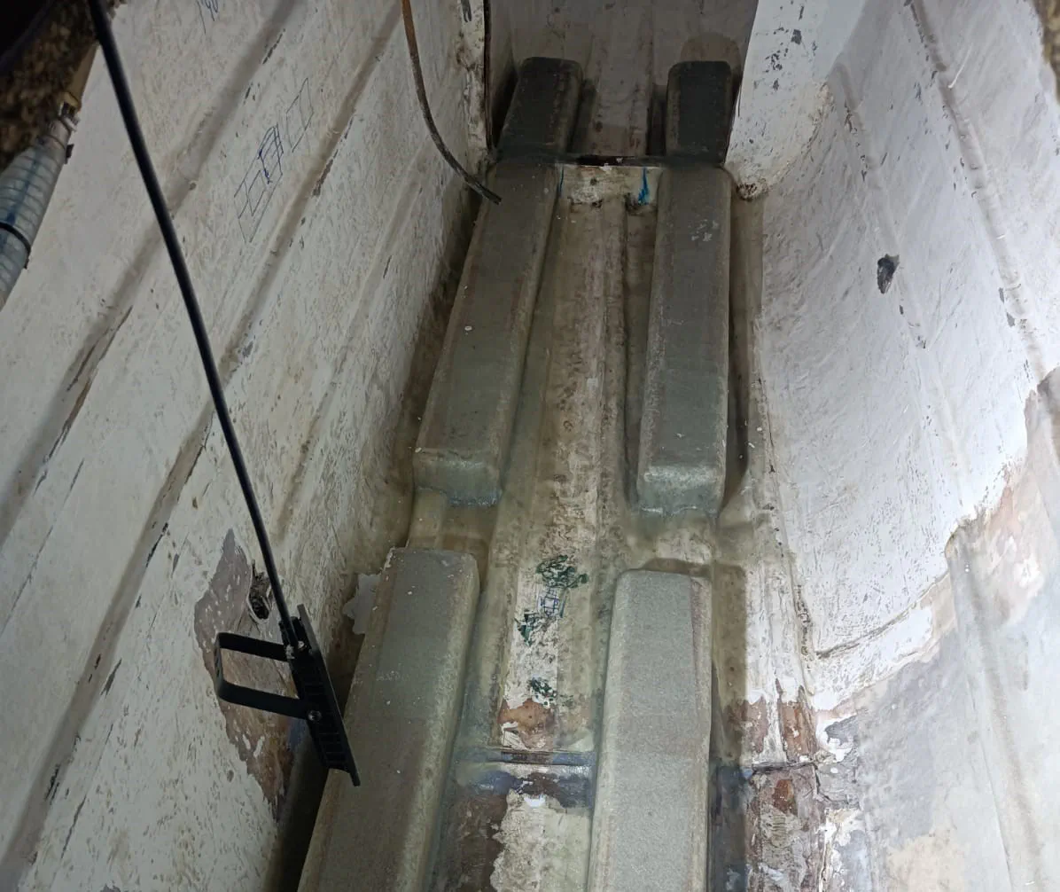 The new fiberglassed supports for the battery banks in the port engine room.