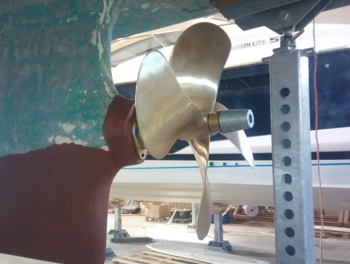 New 4-Blade Propeller A close-up of the newly installed four-blade propeller and sacrificial anode on the shaft.