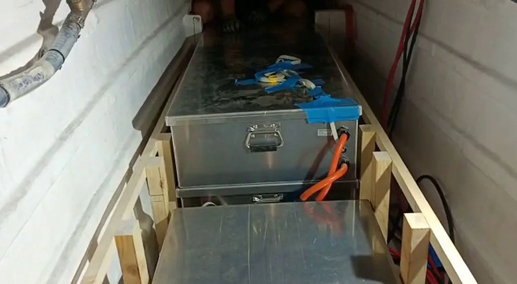 Battery Bank Installation Three of the four battery boxes installed in the port hull, ready for wiring.