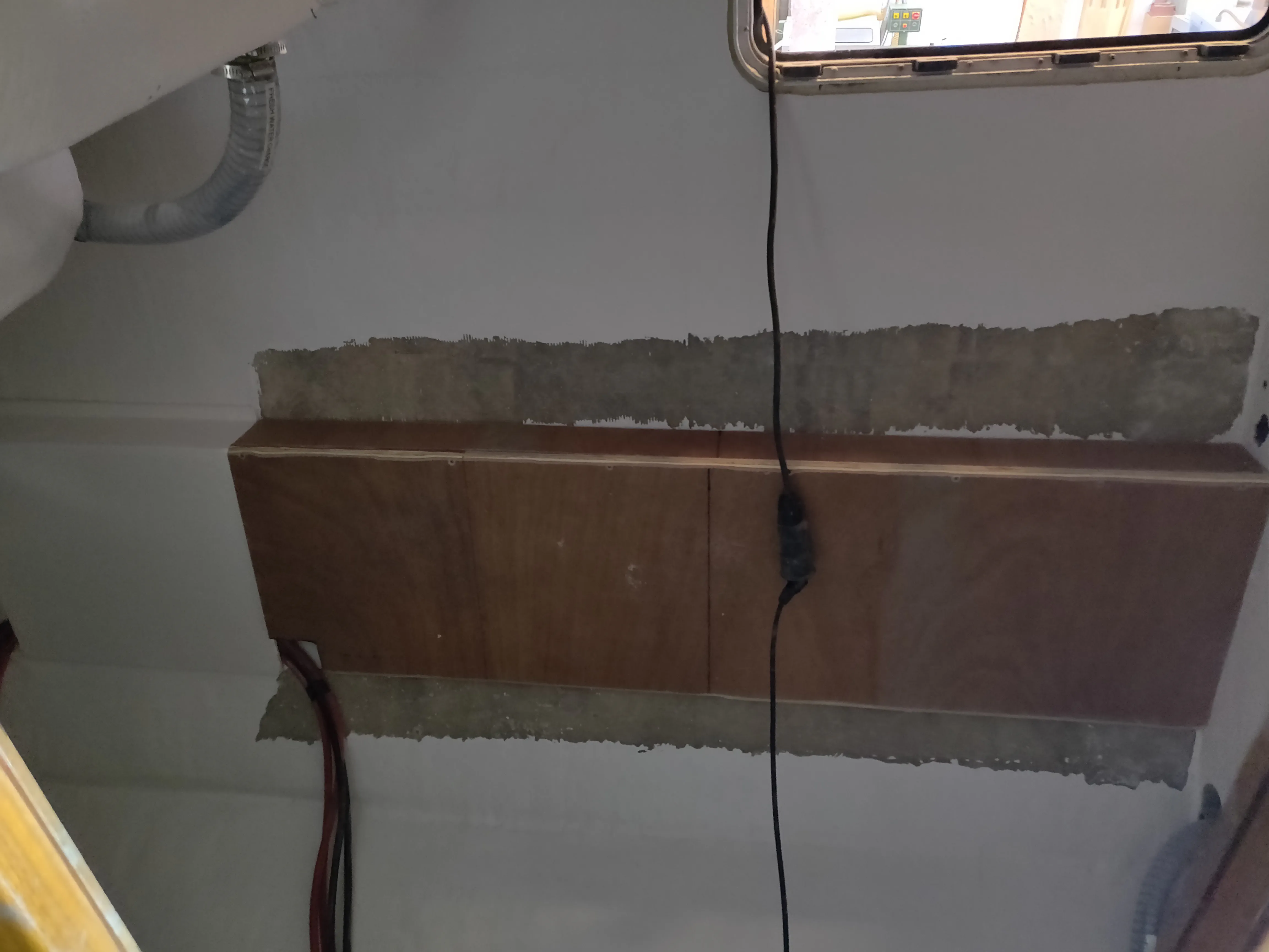 The custom fiberglassed support for the large MPPT solar charge controllers.