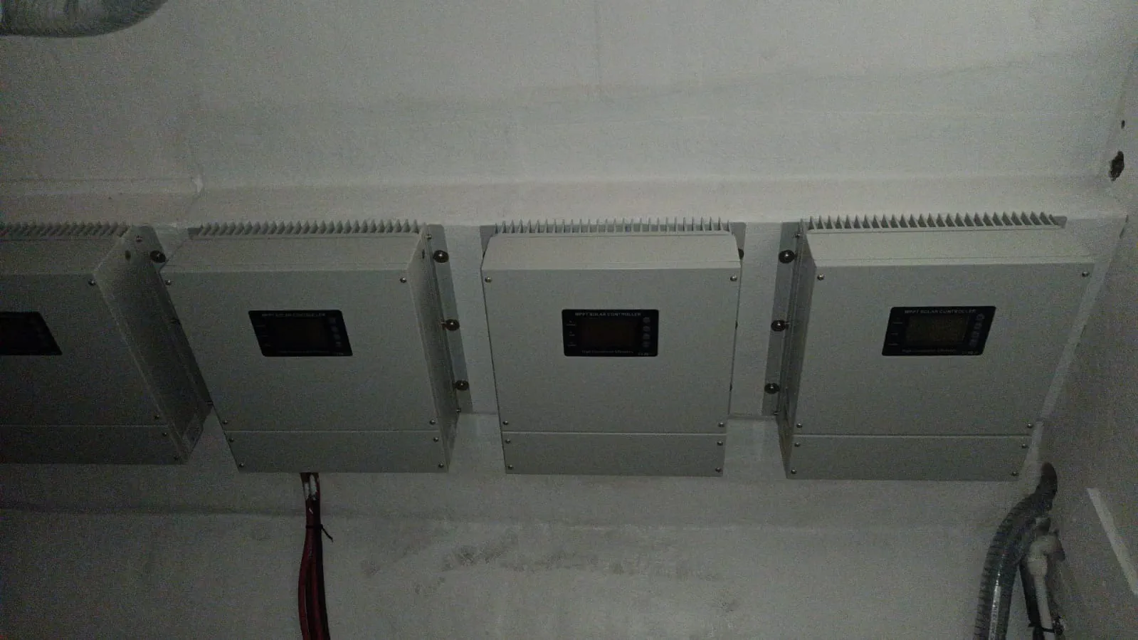 A close-up of the clean and finished installation of the MPPT controllers.