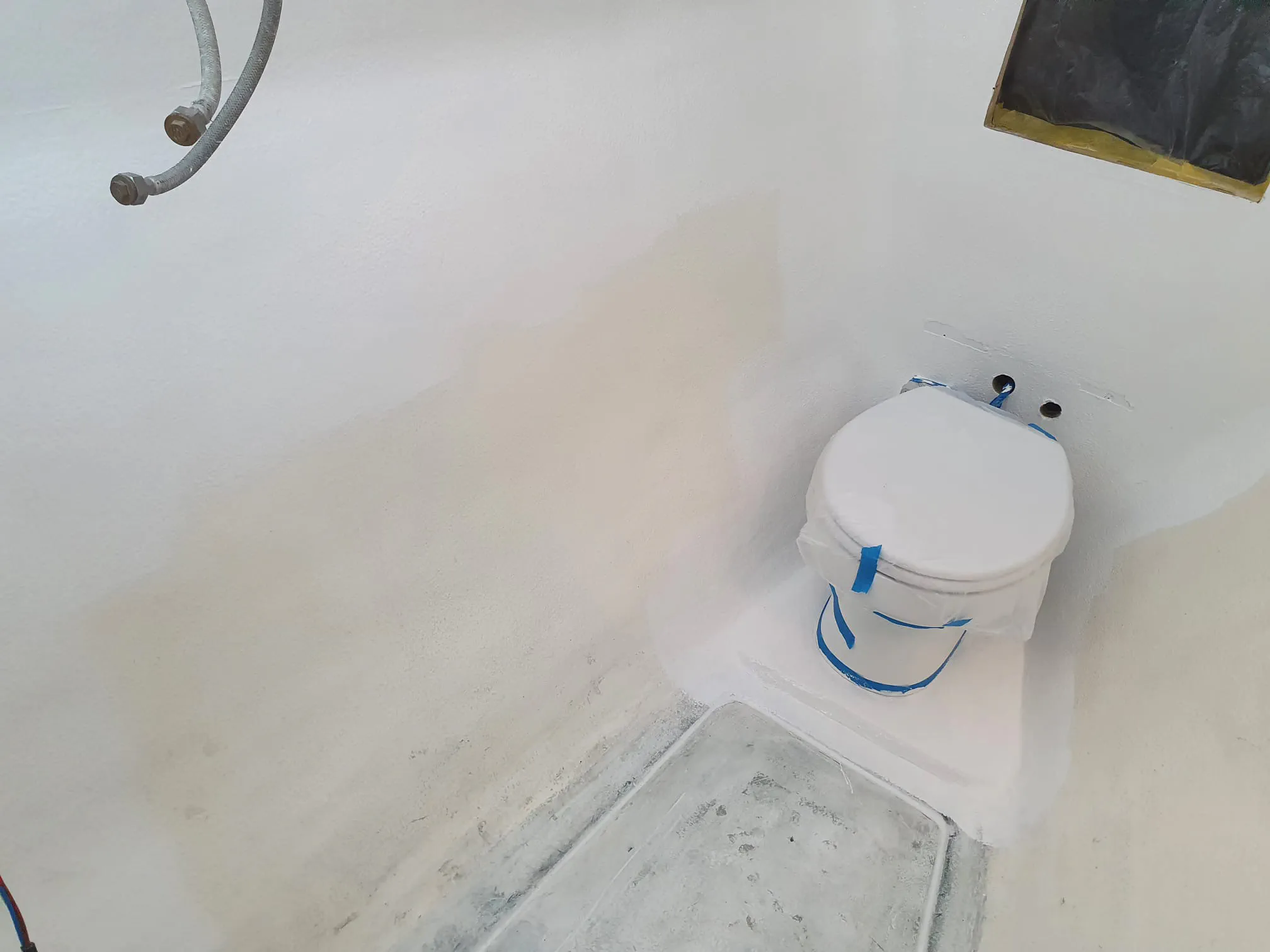 The forward starboard bathroom after being painted with Danboline.