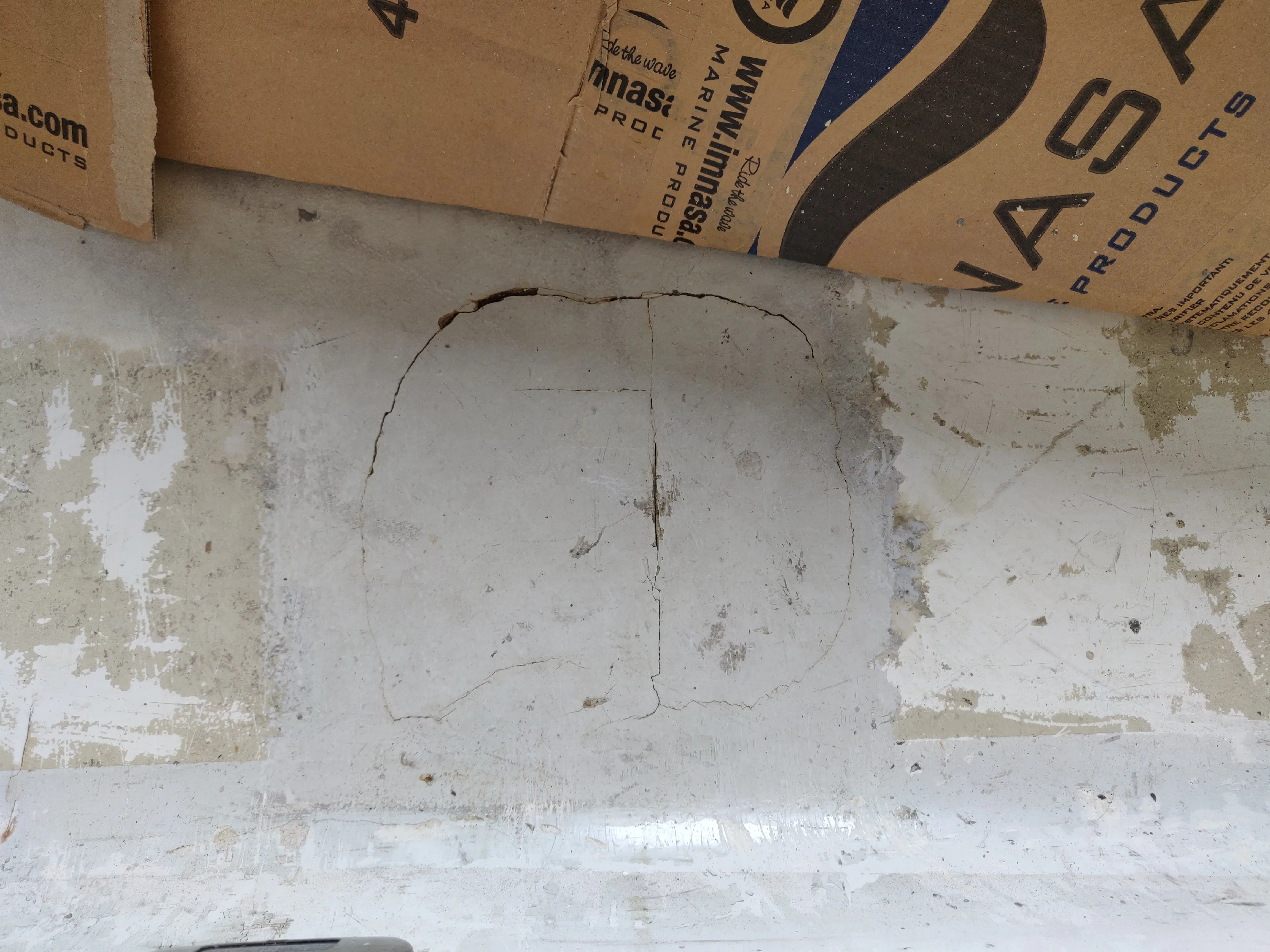 Fiberglass Stress Cracks Cracks in the fiberglass above the steering cylinder mounts.