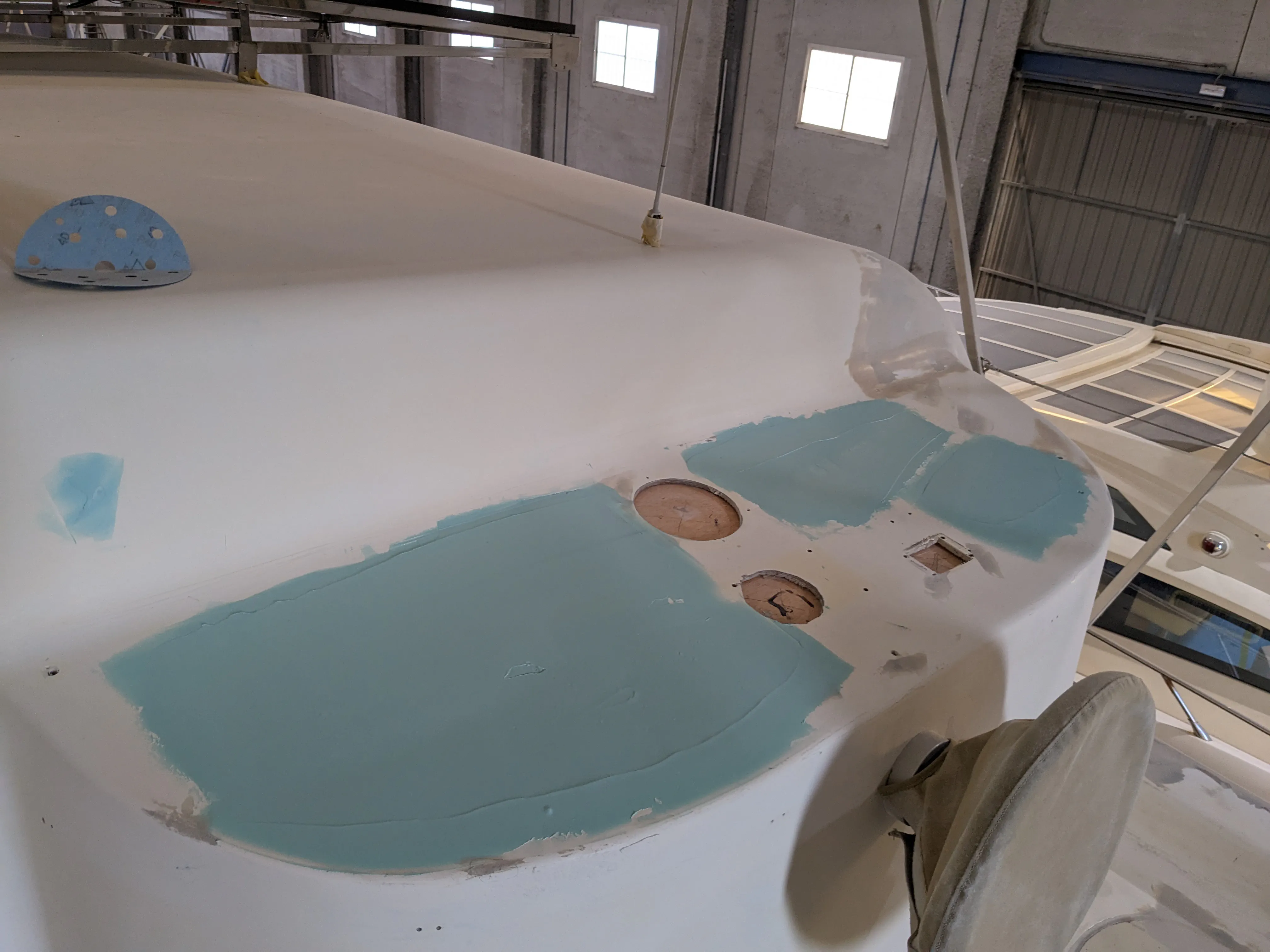 Epoxy filler applied to unused holes of the flybridge console Flybridge console with filler applied