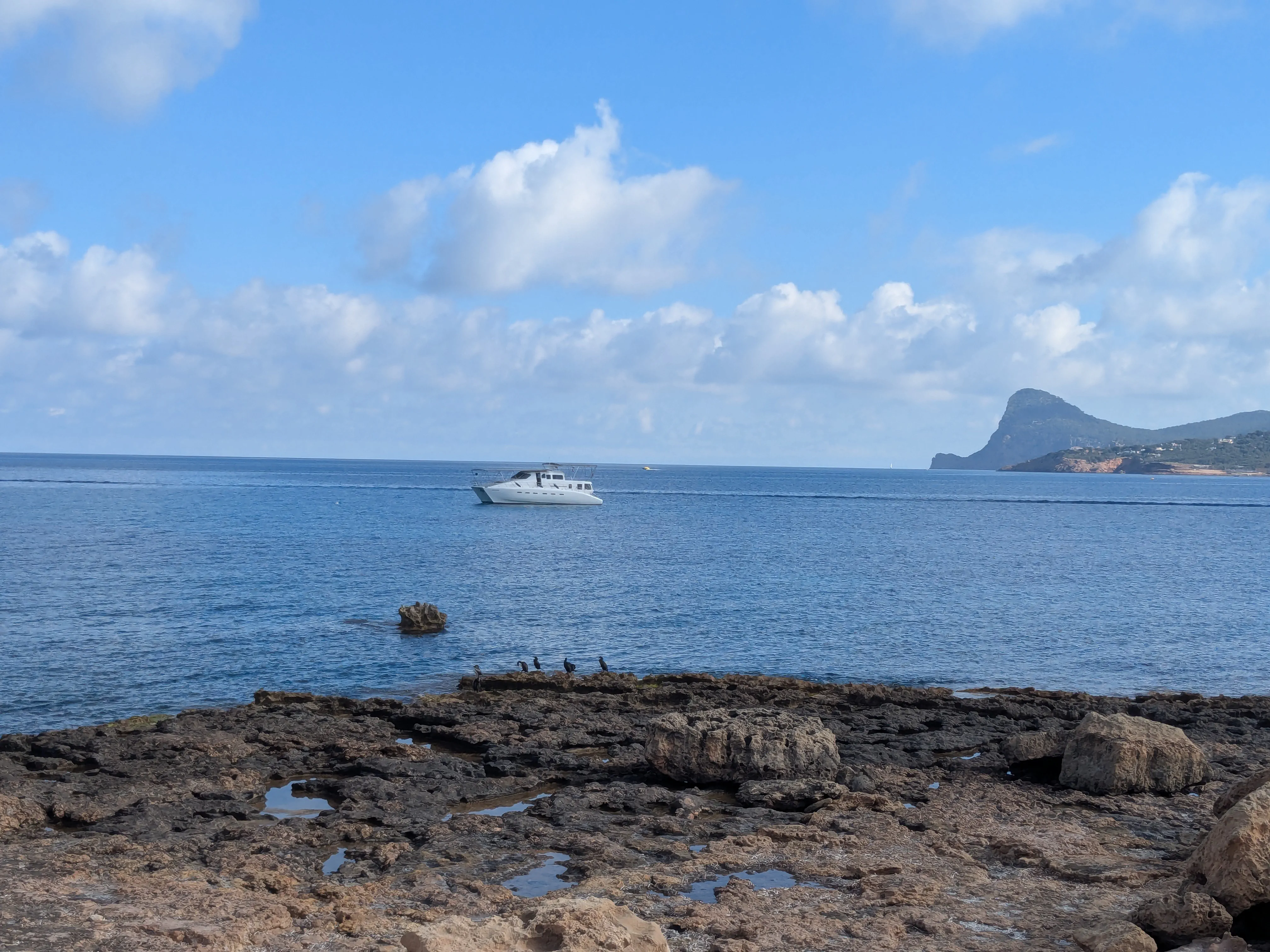 Anchored at Punta d'en Ribes Escargot at anchor in the clear waters of Punta d'en Ribes