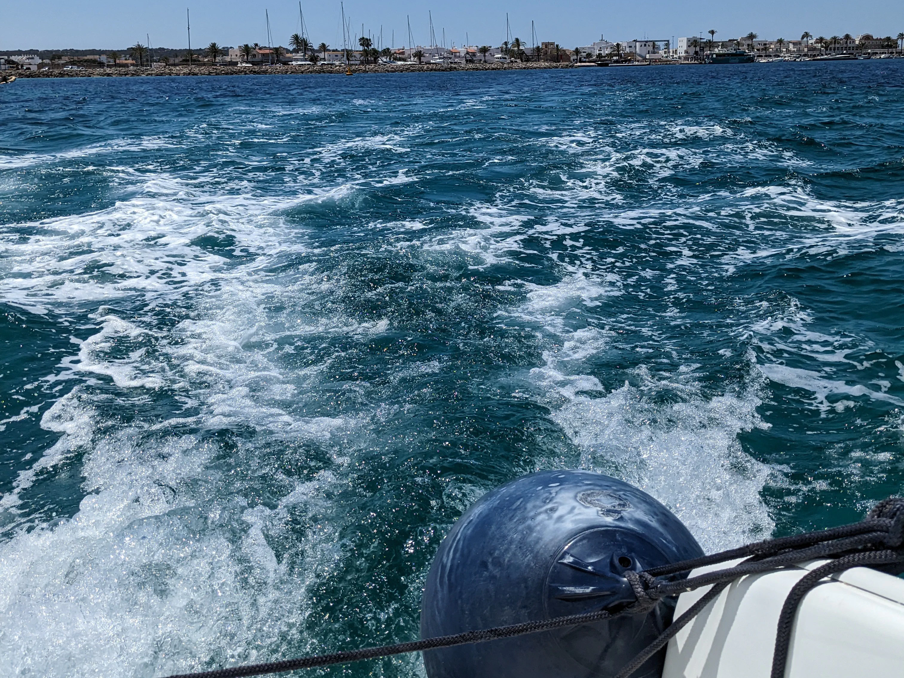 Leaving La Savina Escargot exiting the busy harbor of La Savina